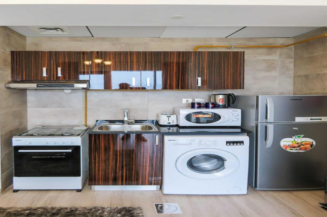 Oyo 860 Studio Apartment, Maya Tower 4, Jumeirah Village Triangle ドバイ エクステリア 写真